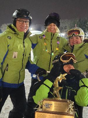 Wyatt and 2026 Team and Skier of the Year trophy (2014 recipient)
